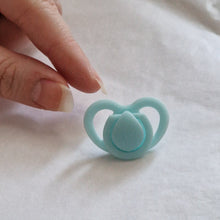 Miniature dummy/pacifier for silicone dolls
